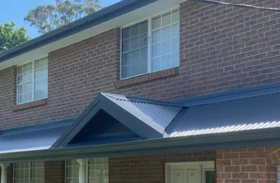 New Colorbond roof and gutters on a brick home, Central Coast