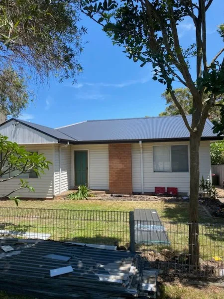 New Colorbond metal roof on a single-storey Central Coast home