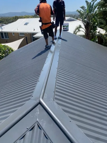 Our roofers installing a new metal roof on the Central Coast